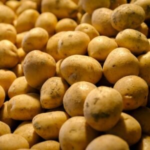 a pile of potatoes sitting on top of a table